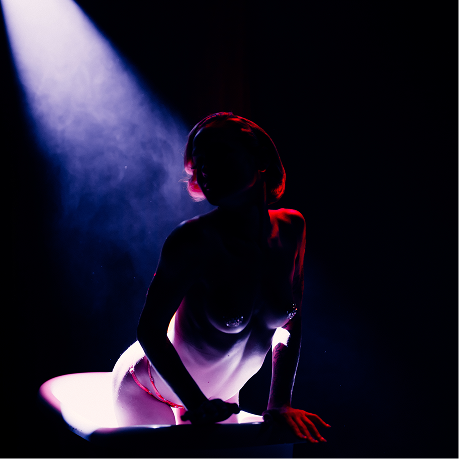 A silhouetted figured in lingerie