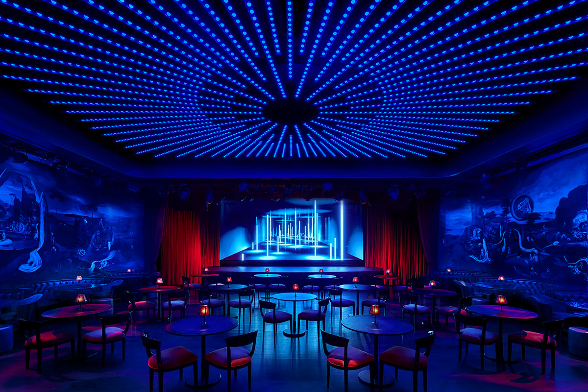 The Paradise Club set up for a cabaret-style event, with round tables and chairs across the floor
