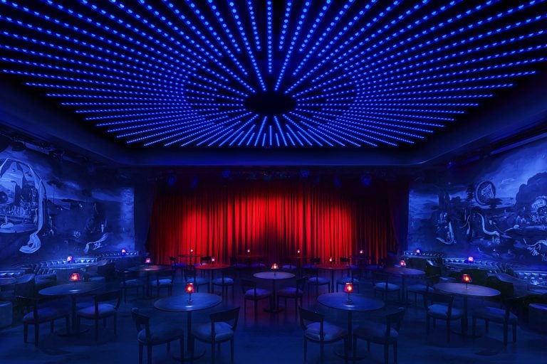 The Paradise Club set up for a cabaret-style event, with round tables and chairs across the floor