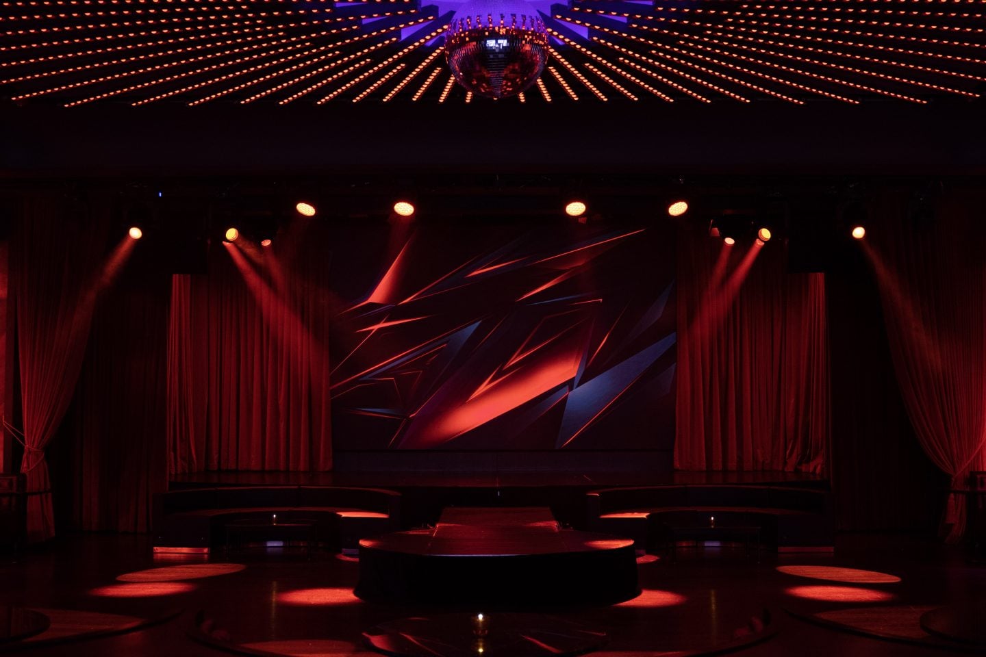 a dark stage at the Paradise Club in NYC