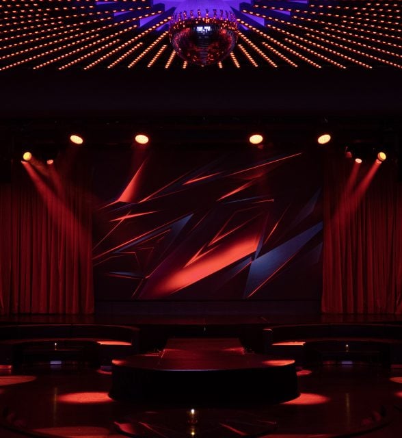 a dark stage at the Paradise Club in NYC