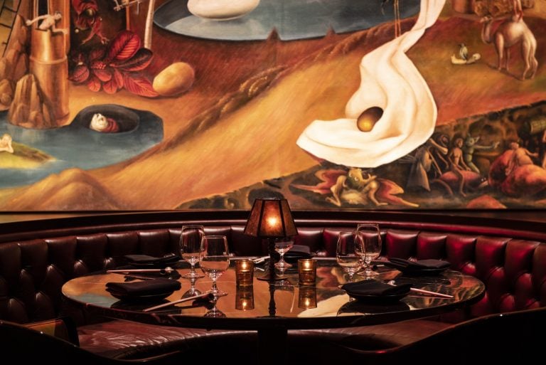 a booth at the Paradise Club in NYC set with glassware