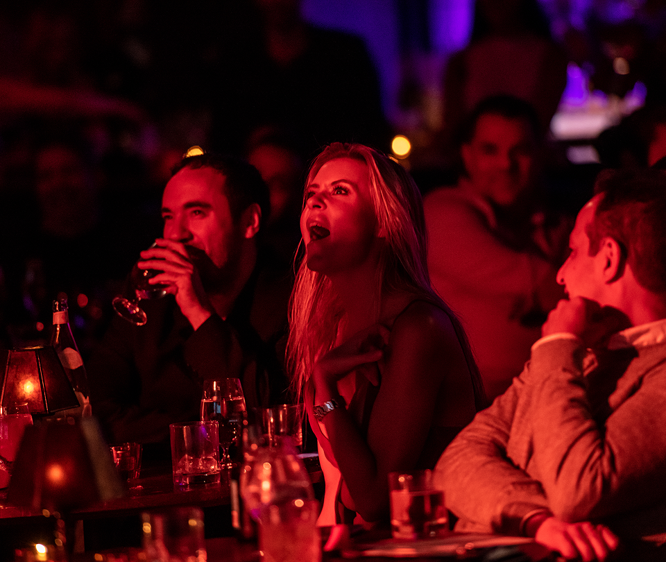Audience members reacting to a show